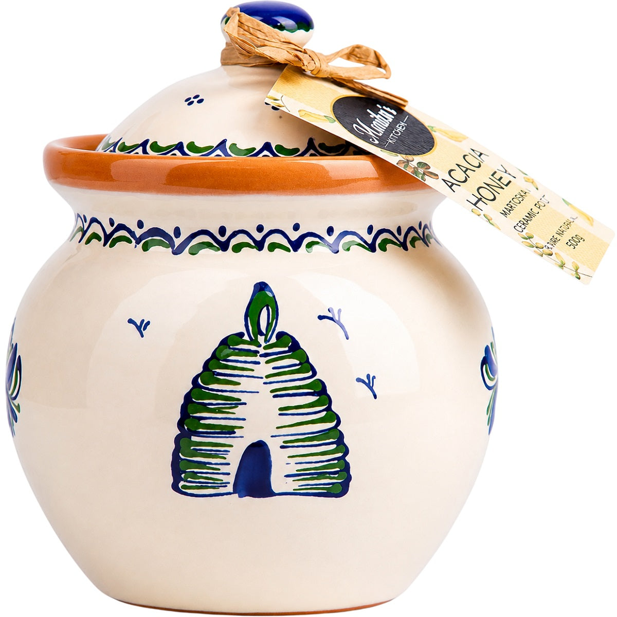 A jar of acacia honey in an artisan hand-painted Hungarian ceramic honey pot with a lid, ideal as a craft gift.