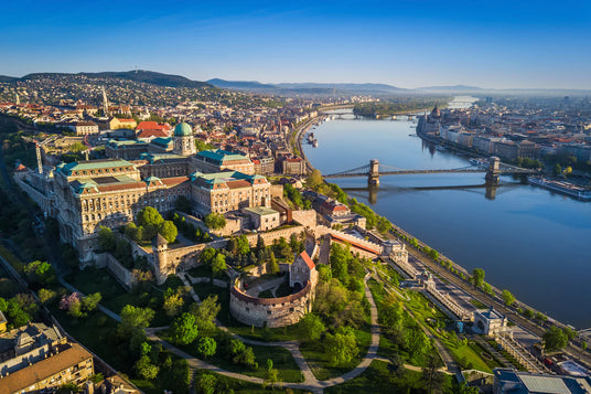 A drone view panorama of Budapest's Castle Hill, the Chain Bridge, the Hungarian Parliament and Margit Island.