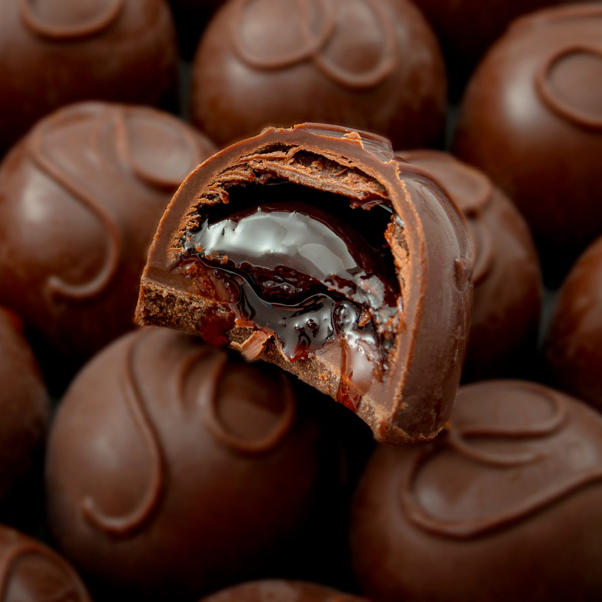 Luxury cherry liqueur chocolates, made from whole cherries soaked in brandy and covered in Belgian dark chocolate.