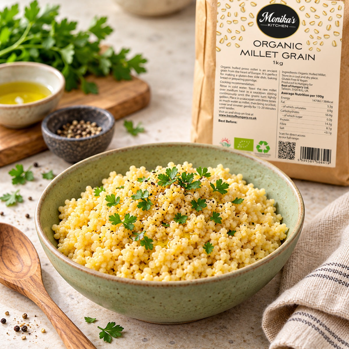 A bowl of cooked millet, a gluten-free side dish, with a bag of Monika's Kitchen Organic Millet Grain in the background.