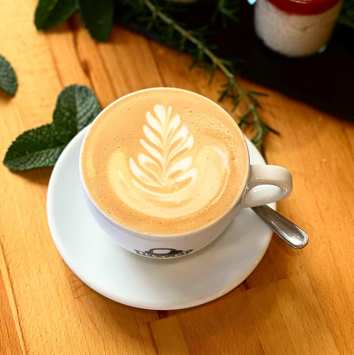 A cup of cappuccino from roasted Costa Rican coffee beans.