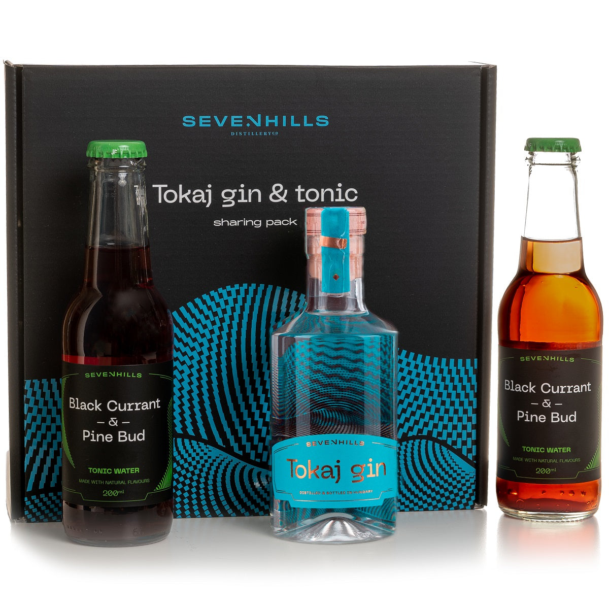 A gift pack with a bottle of dry gin, two bottles of tonic water and a gift box.
