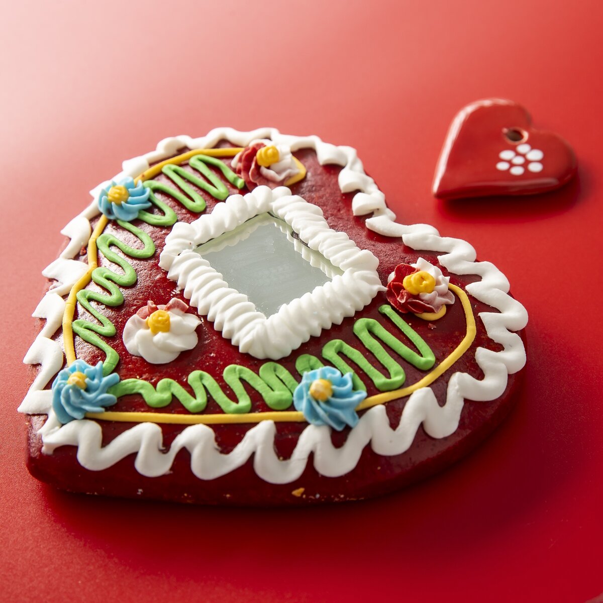 A handmade gingerbread heart cookie, this is a stylish decorative ornament and gift.