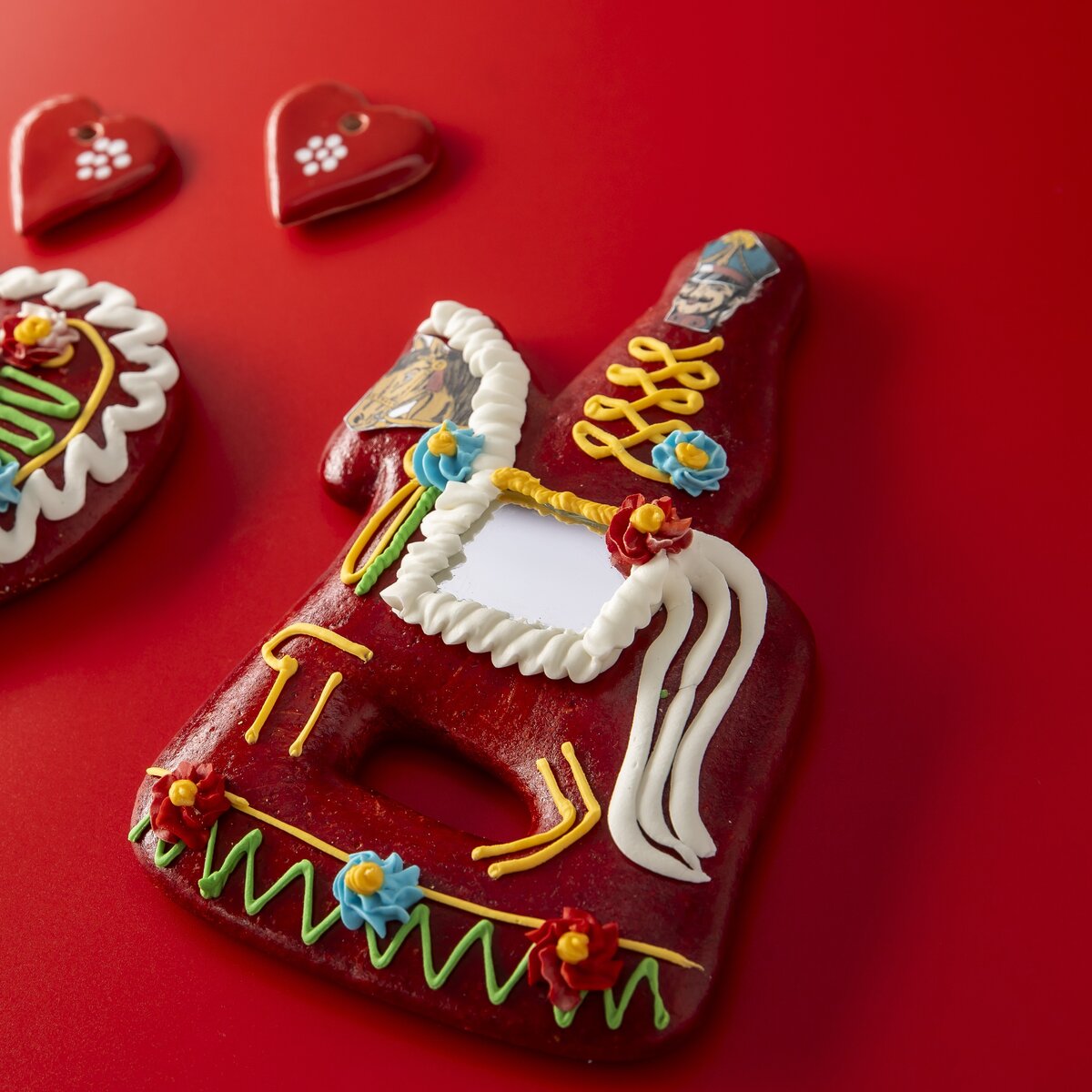 A red gingerbread soldier figure.