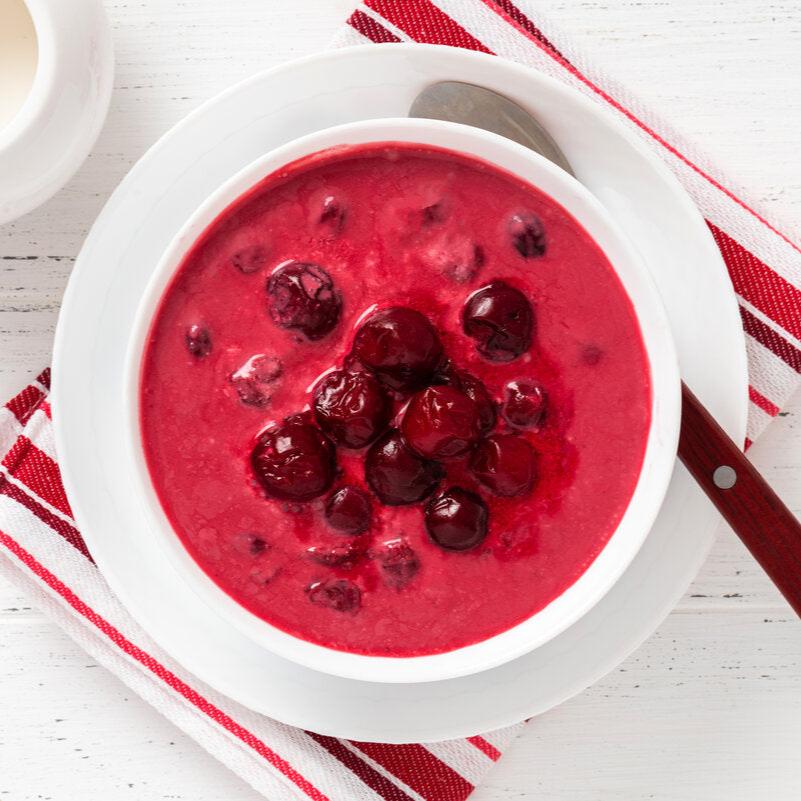 A bowl of gyumolcsleves, a Hungarian cold fruit soup made with cherries using a traditional recipe.