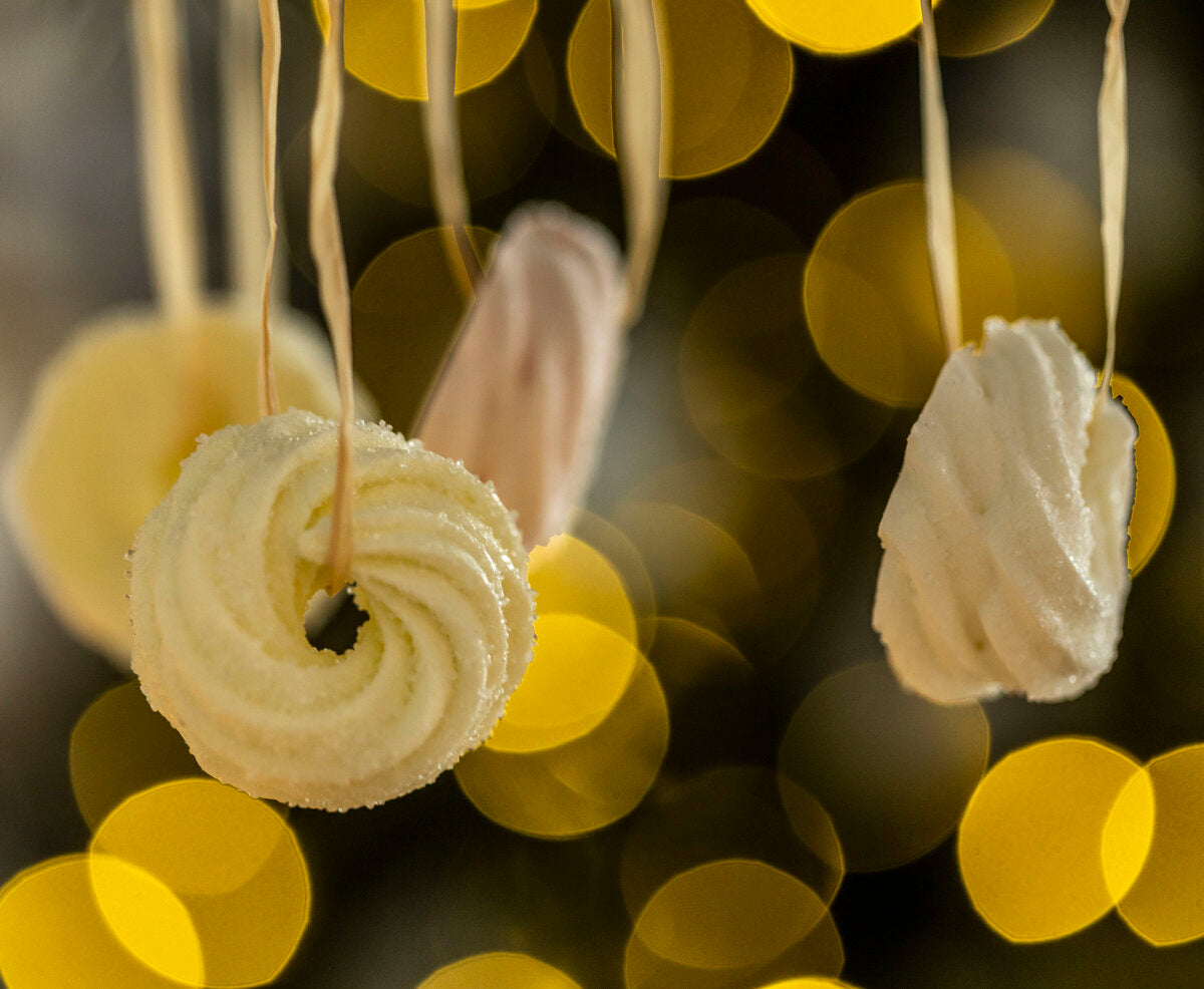 Habkarika Christmas decorations hanging from strings.