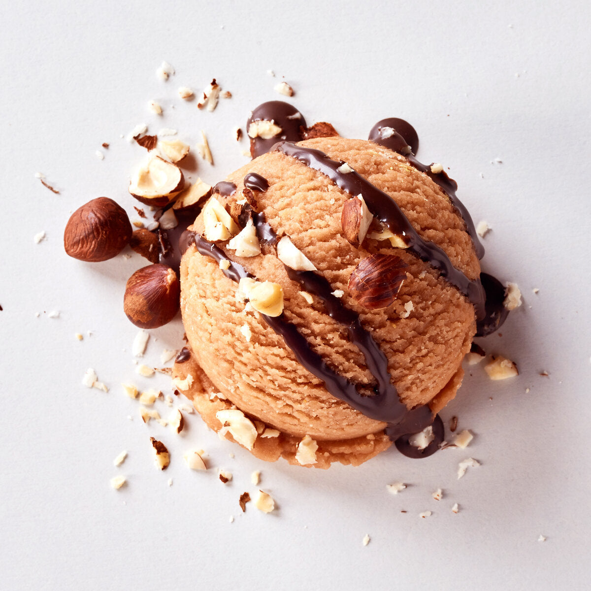 Hazelnut ice cream with a drizzle of hazelnut oil and chocolate.