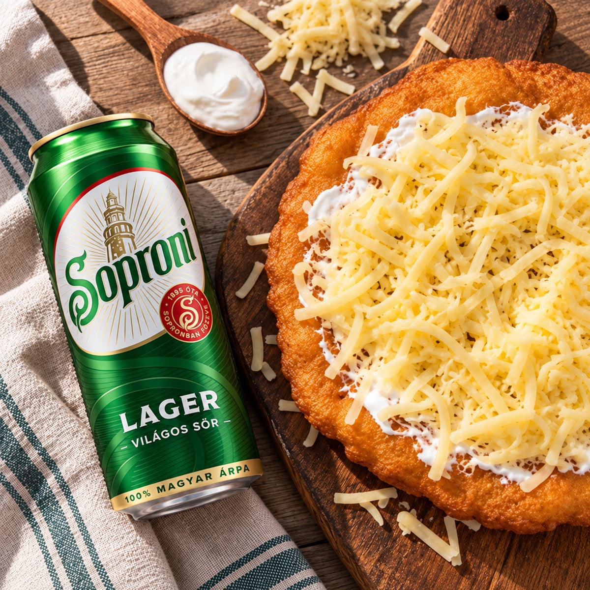 Lángos Hungarian fried bread dough from Budapest with a can of Soproni beer.