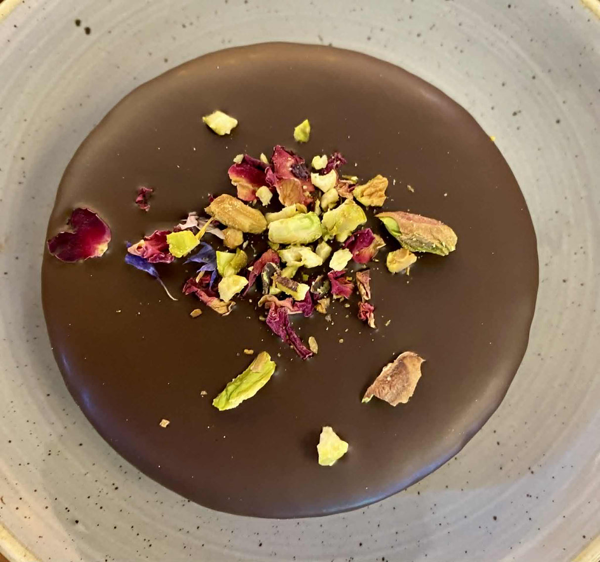 An traditional Ischler, which is a Linzer cookie covered in chocolate.