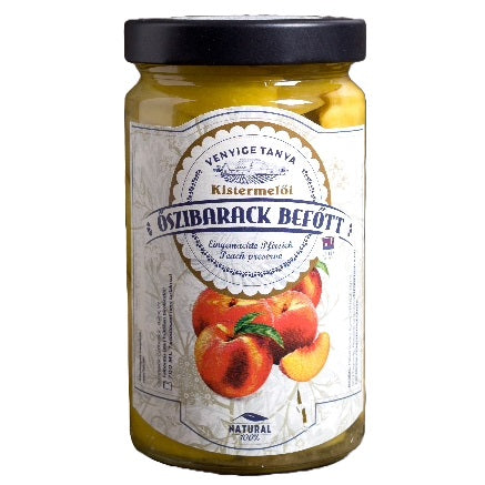 A jar of peach compote from fresh fruit made using a traditional recipe.