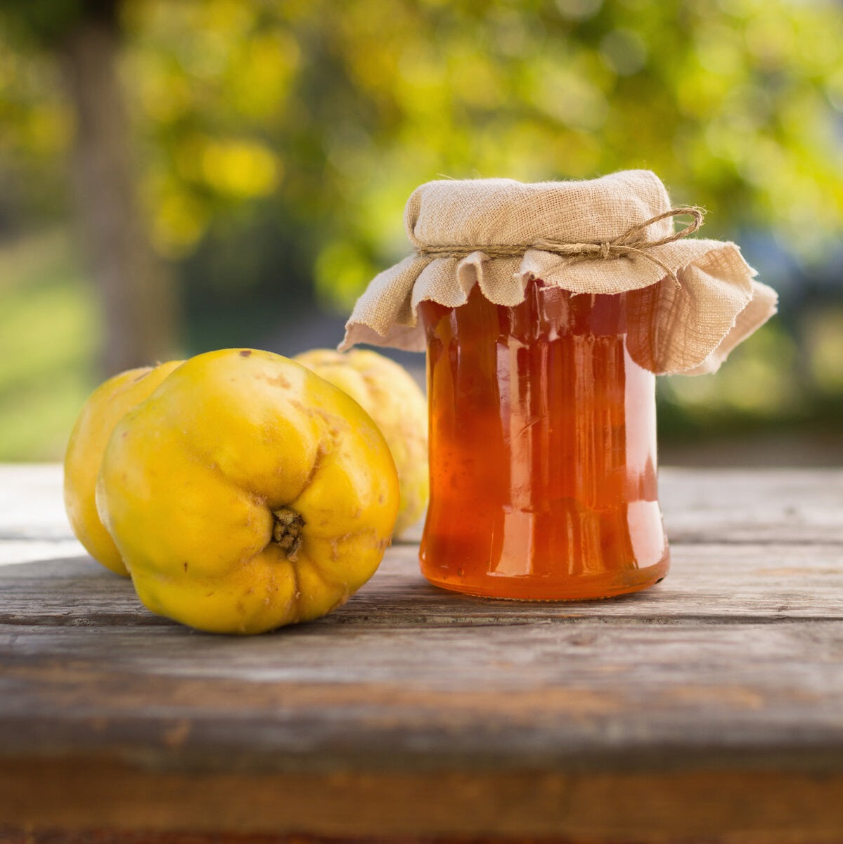 A jar of quince jam from fresh fruit, naturally sweetened with honey.