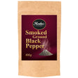 A packet of smoked ground black pepper spice.