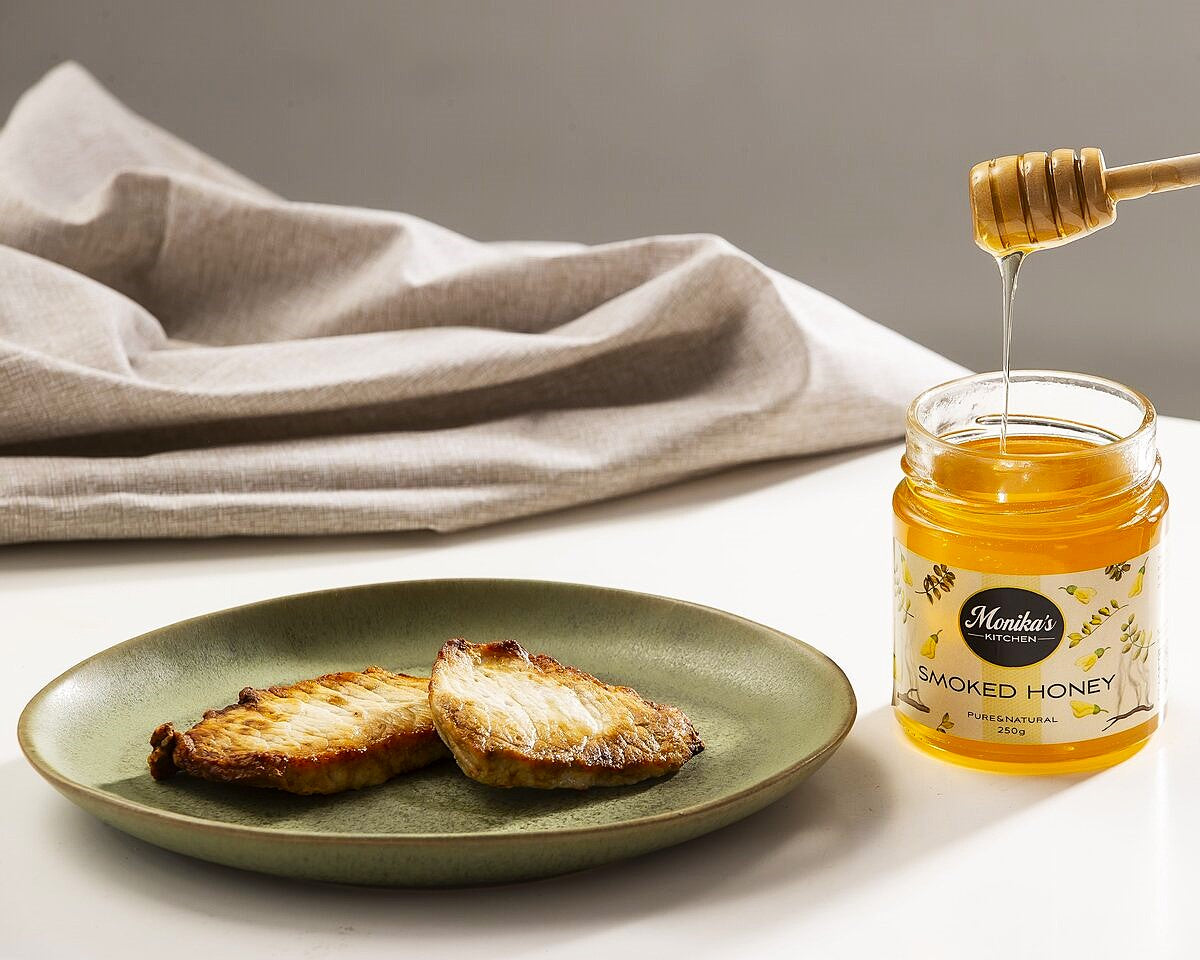 Smoked honey drizzled over roast ham.