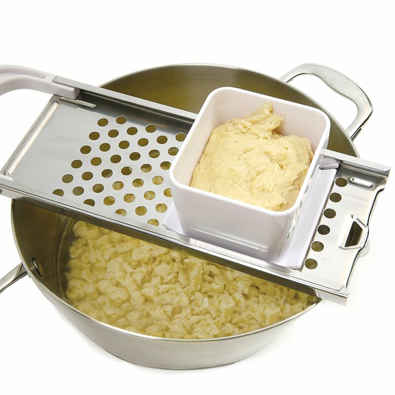A spaetzle maker machine, this German spaetzle press is a tool for making traditional noodles.