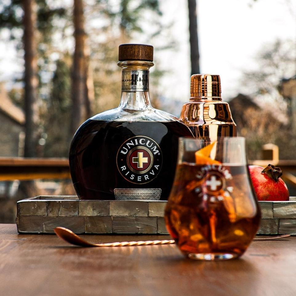 A glass of Unicum Riserva alcoholic herbal spirit and digestif drink.