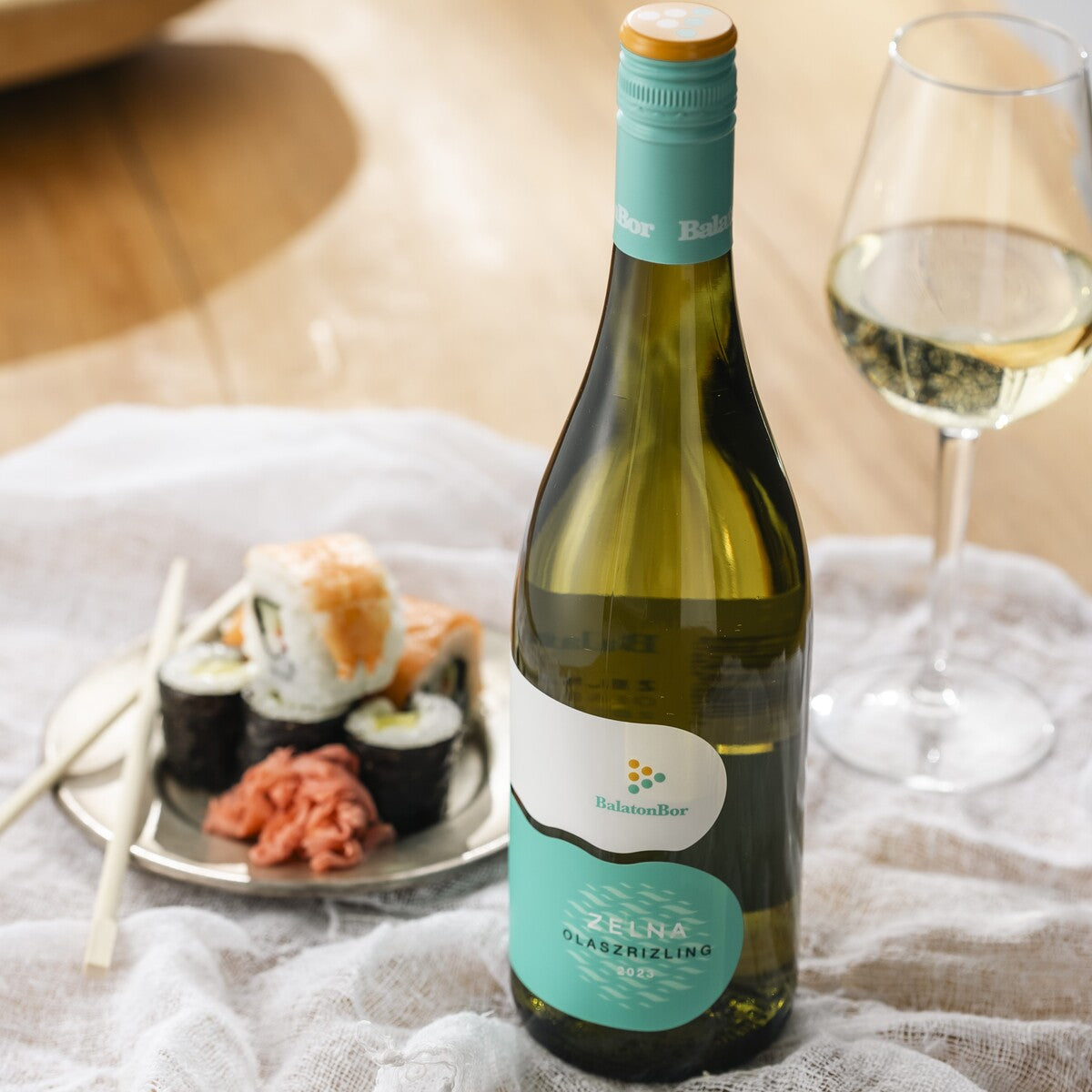 A bottle of BalatonBor dry white wine, it is the best wine pairing to drink with sushi.