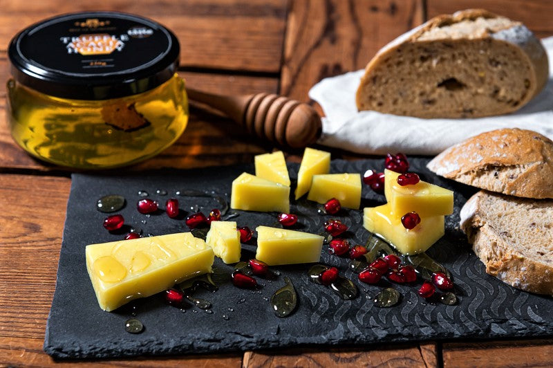 Black truffle infused acacia honey is the best gourmet pairing for cheese.