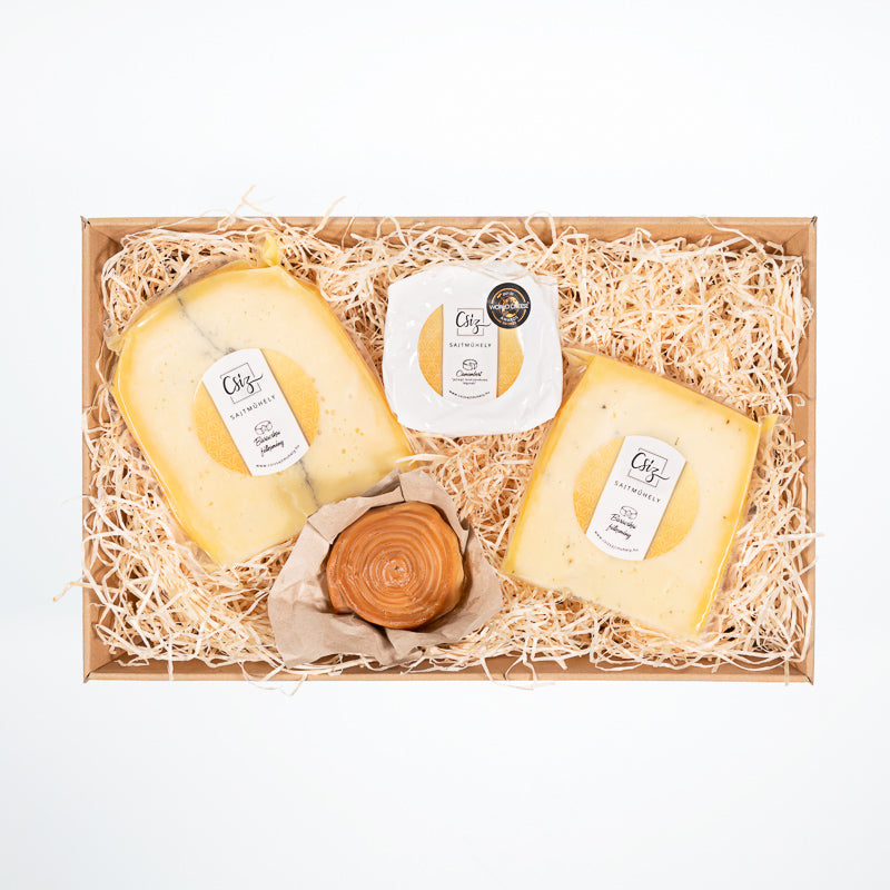 A luxury cheese hamper, this gourmet gift basket contains a selection of the four best artisan cheese.