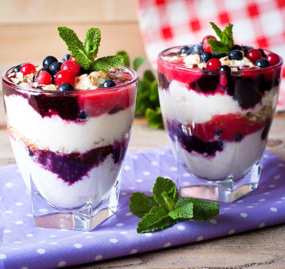 A healthy fruit cup dessert recipe with a drizzle of balsamic vinegar.