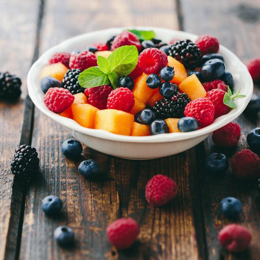 A healthy fruit salad recipe with a drizzle of balsamic vinegar.