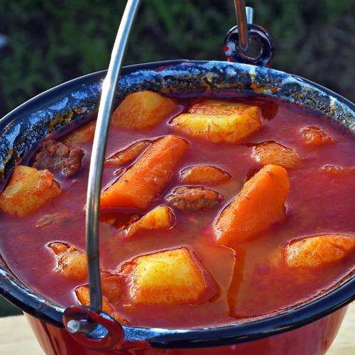 A traditional goulash pot, this enamel metal cauldron is best for cooking authentic Hungarian soup recipes.
