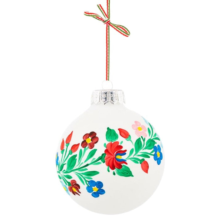 A glass Christmas tree bauble, this traditional Hungarian decoration is hand-painted with folk art motives.