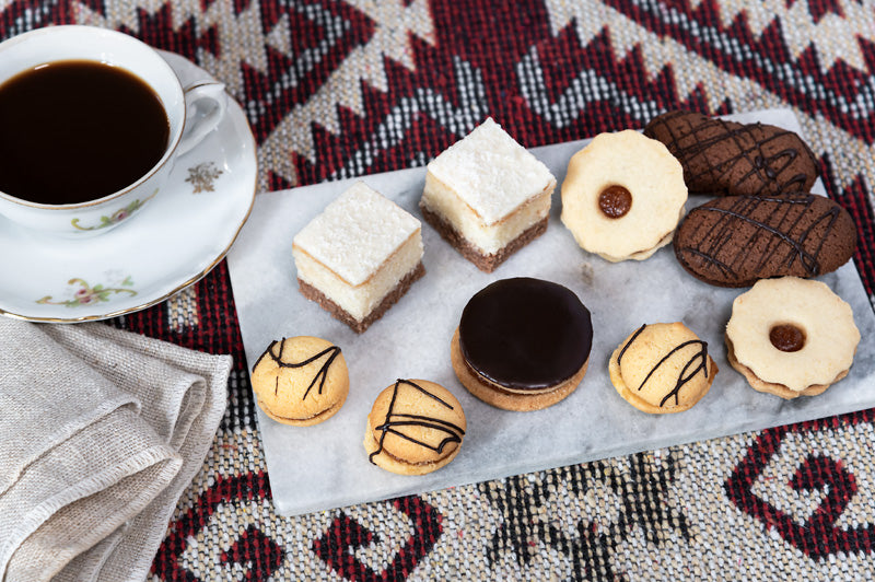 A selection of mixed petits fours patisserie, these artisan cakes and biscuits are perfect for an afternoon high tea.