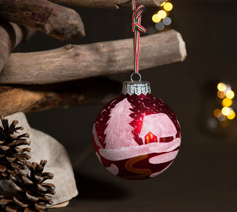A red glass Christmas ornament.