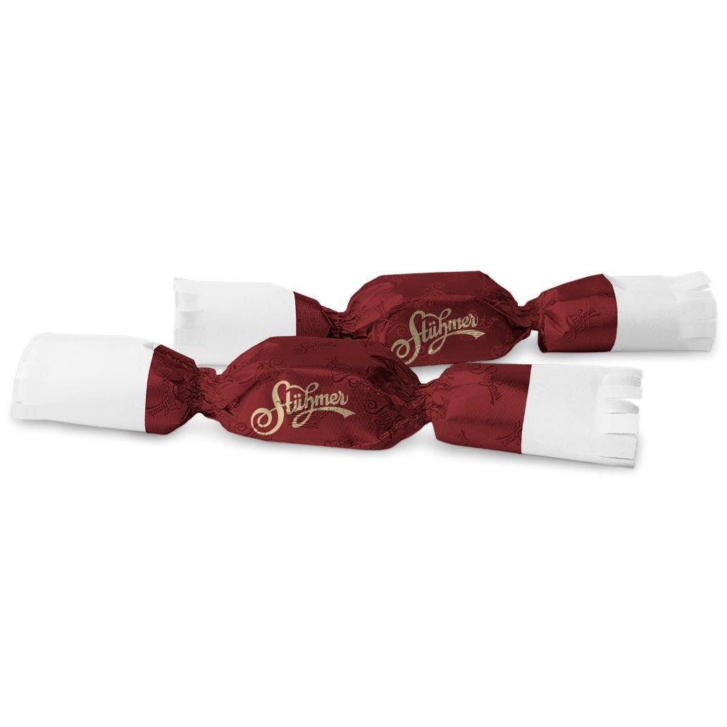 A couple of almond marzipan pralines filled with sour cherry cream and dipped in dark chocolate.