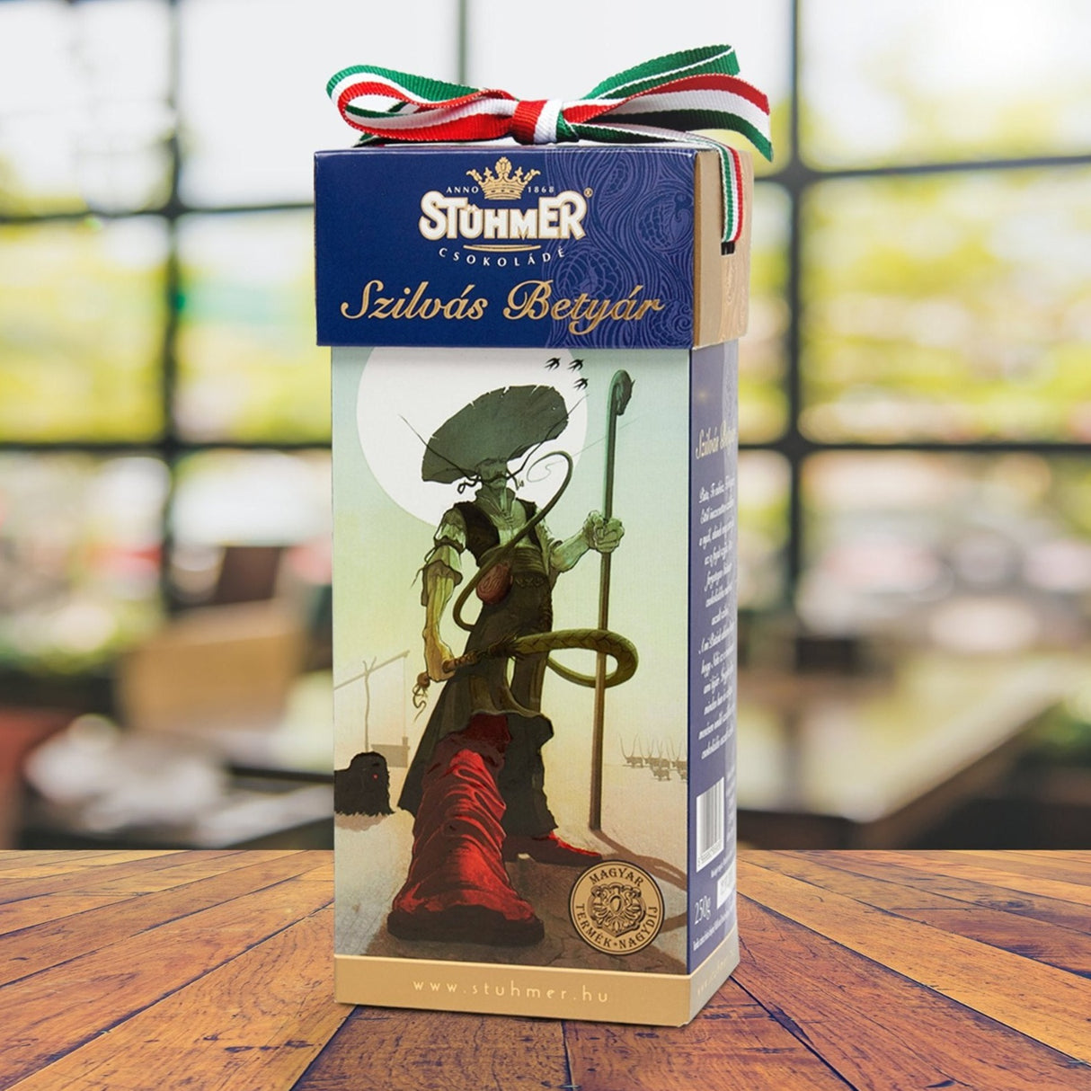 Szilvás Betyár are chocolate covered plums in a gift box decorated by folk art from the Hungarian Stühmer brand.