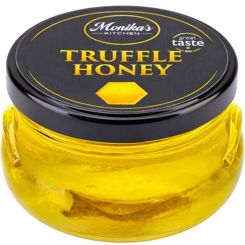 A jar of truffle honey made by infusing acacia honey with black summer truffle slices.