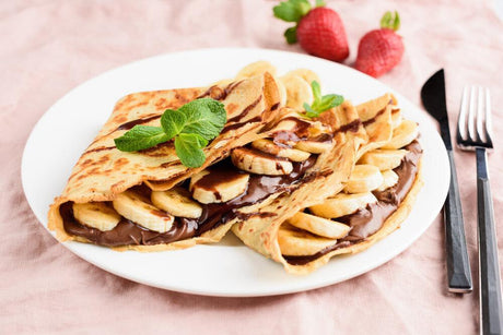 Easy palacsinta recipe for making traditional Hungarian crêpe style thin pancakes, best with Nutella and banana.
