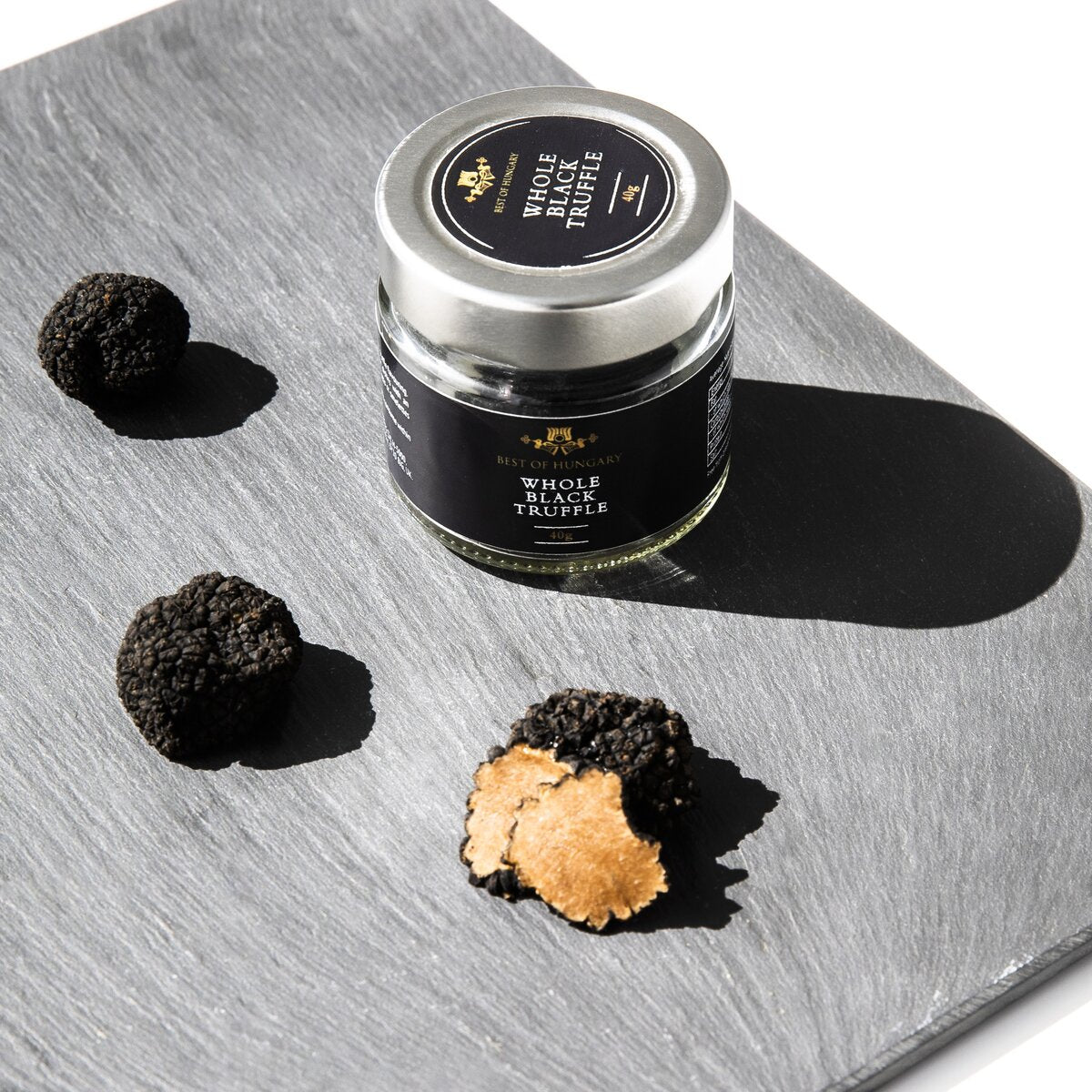 Whole pieces of black summer truffles in their own juice.