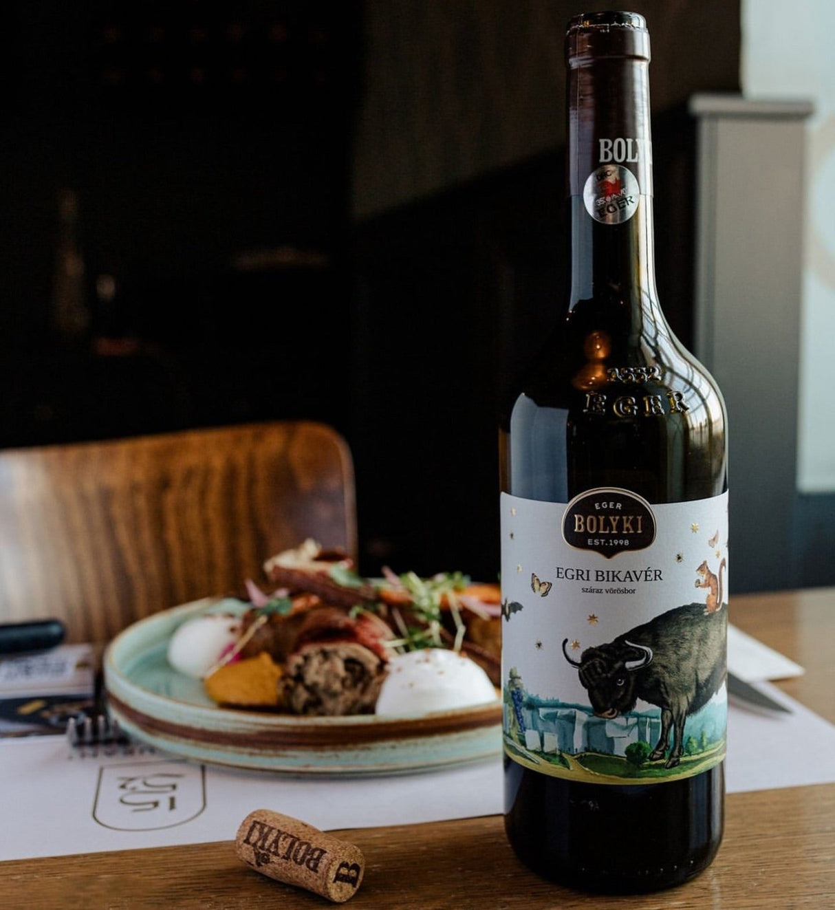 A bottle of Bolyki Egri Bikavér Hungarian Bull's Blood red wine is the best wine for food pairings.