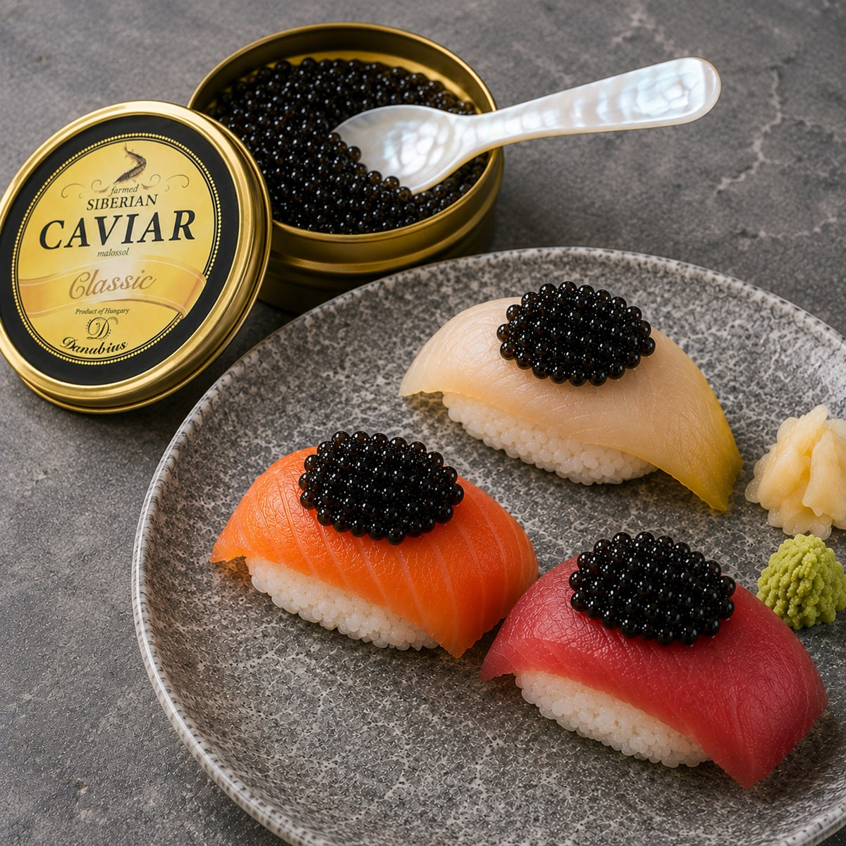 Three types of sushi with black caviar on a plate next to a container of sturgeon caviar.