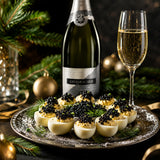 A bottle of Kreinbacher Prestige Brut Hungarian champagne with black sturgeon caviar served on quail eggs.