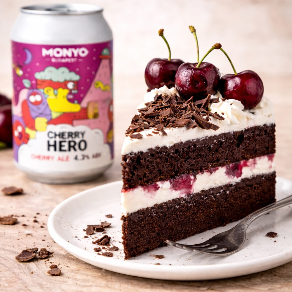 A slice of black forest gateau cake on a plate with a can of cherry beer in the background.
