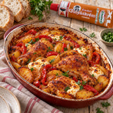 A baked chicken and potato casserole with bread and parsley, with a tube of Mild Goulash Paste in the background.