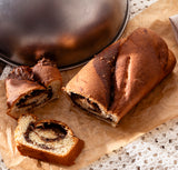 A chocolate babka cake on brown paper.