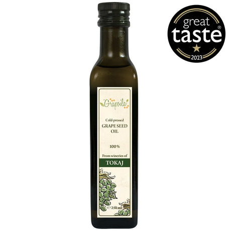 A bottle of cold-pressed grapeseed oil, this is the best healthy cooking oil for frying and baking.