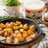 Cooking roasted potatoes in pork lard.