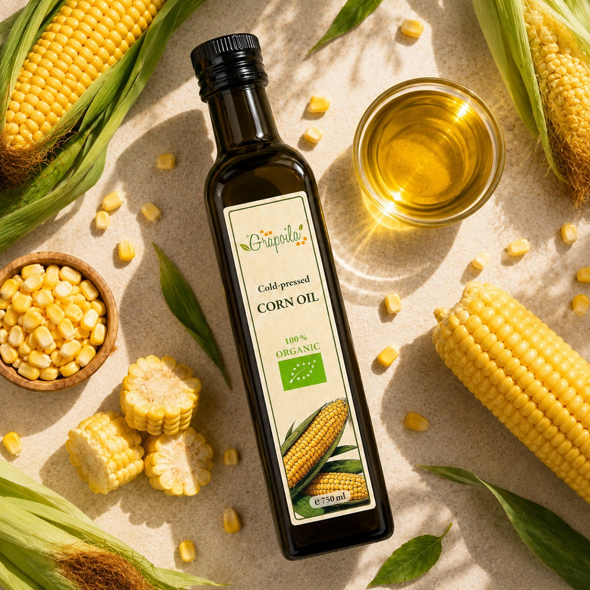 Bottle of organic cold-pressed corn oil with fresh maize and corn on the cob.