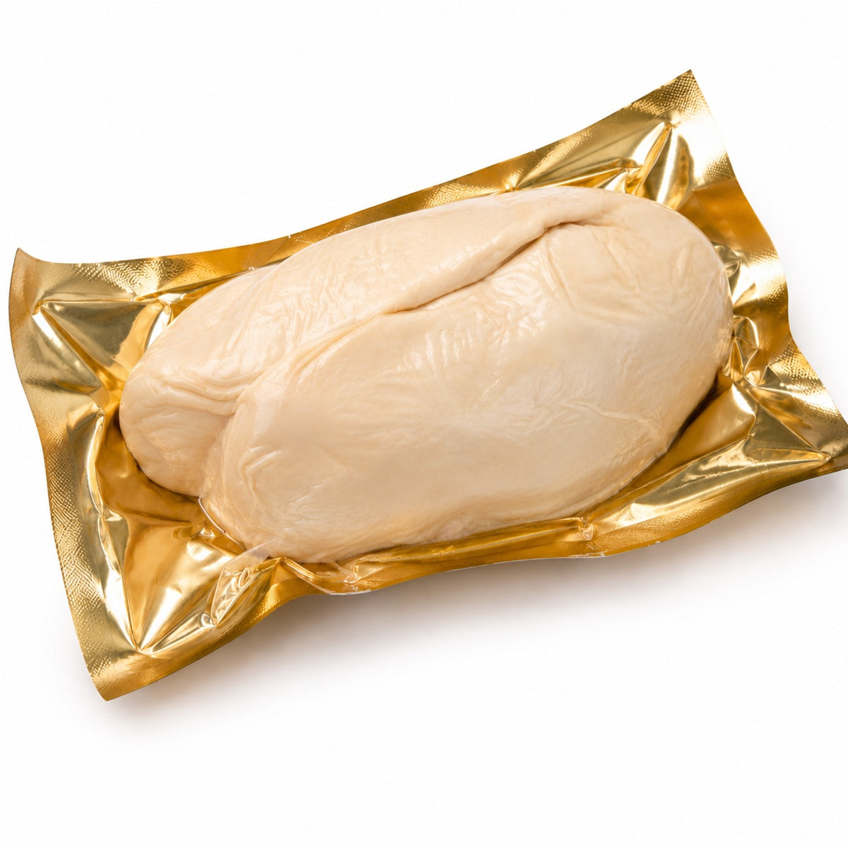 A piece of whole fresh goose liver foie gras in golden packaging.
