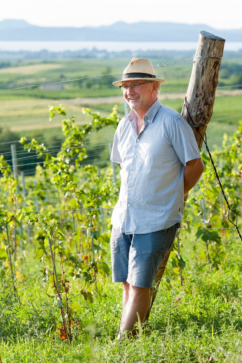 Hungarian winemaker Geza Legli standing in his vineyard on the shores of Lake Balaton.