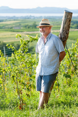 Hungarian winemaker Geza Legli standing in his vineyard on the shores of Lake Balaton.