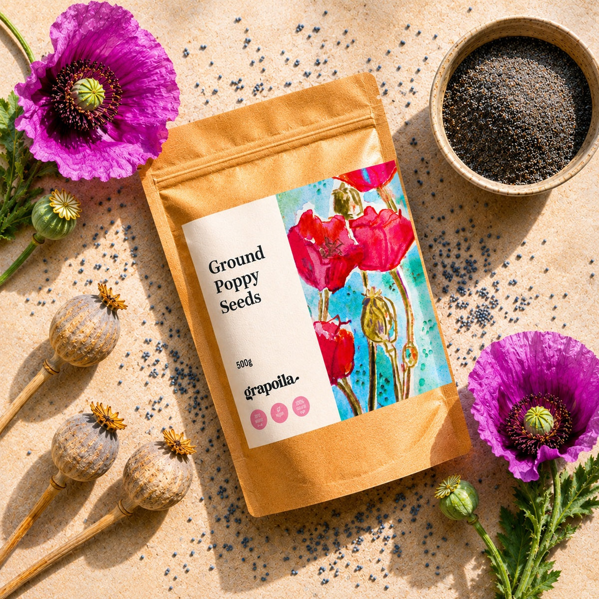Grapoila ground poppy seeds packaging with poppy flowers and seeds on a textured surface
