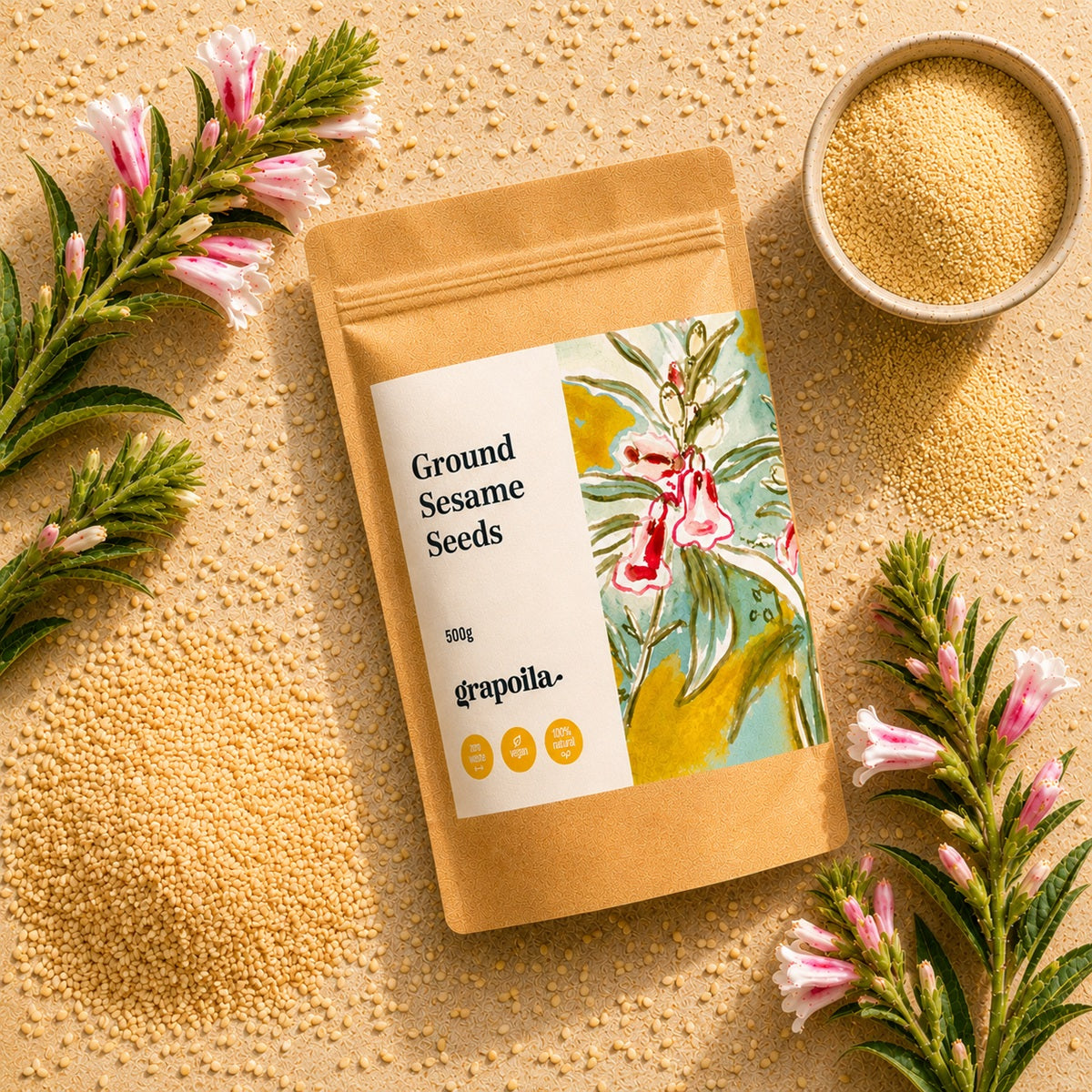 Grapoila ground sesame seeds packaging with sesame flowers and yellow seeds on a textured surface