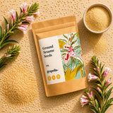 Grapoila ground sesame seeds packaging with sesame flowers and yellow seeds on a textured surface