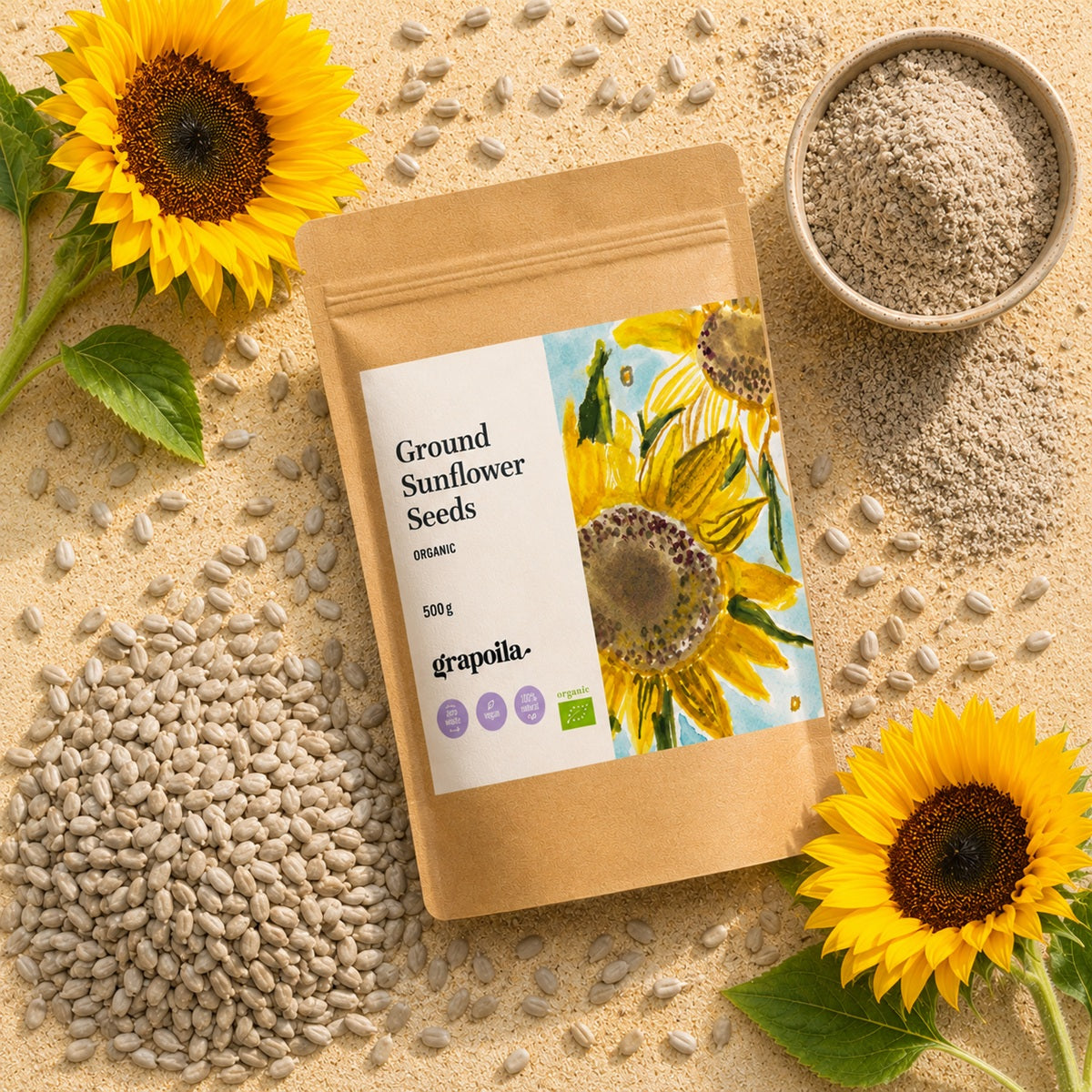 Grapoila ground sunflower seeds packaging with sunflower flowers and raw seeds on a textured surface.