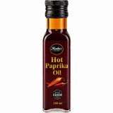 Bottle of hot paprika oil made from cold-pressed spicy paprika seeds.